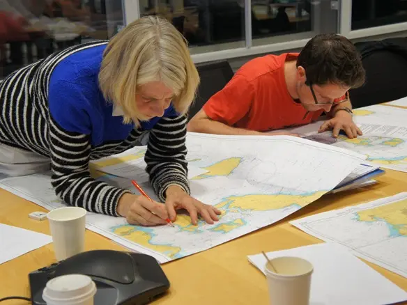 Office-based sailing theory course with navigation equipment on display Office-based sailing theory course with navigation equipment on display